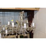 A glass and gilt eight light chandelier