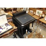 A late Victorian ebonised davenport