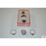 Six sterling silver/silver gilt rings; gem set inc