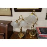 A pair of brass and frosted glass twin branch tabl