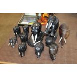 A quantity of various ebony elephant ornaments