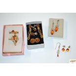 A collection of sterling silver and amber jeweller