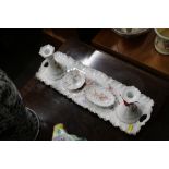 A Carlsbad Austria porcelain dressing table set with cherub decoration