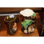 A pottery squirrel decorated jug and a rabbit simi