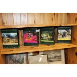 Four boxed jigsaw puzzles
