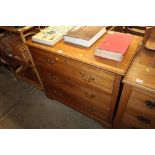 An Edwardian satin walnut chest of three drawers