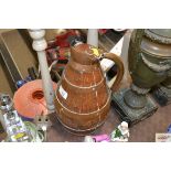 A wooden and copper coopered lidded jug