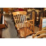 A Victorian elm slat back elbow chair