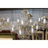 A glass and gilt eight light chandelier