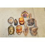A box of various wooden masks etc.