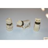 A collection of three bone pillboxes in the form o