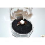 A 9ct gold opal and garnet ring