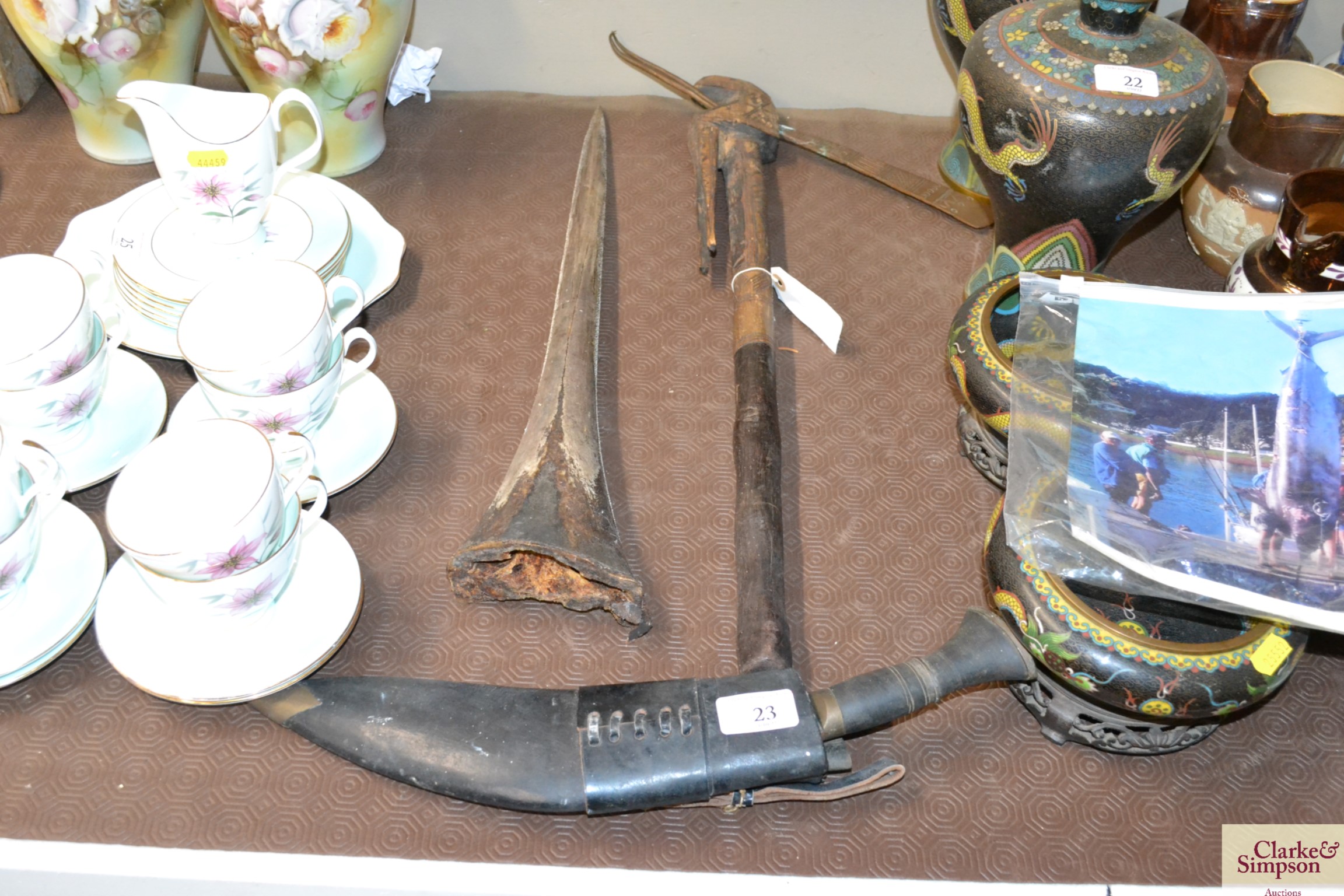 An Ethnic tomahawk; a Kukri knife and a Marlin bill