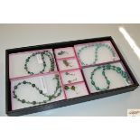 A tray of various hand made jewellery, semi precio