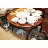 A late Victorian mahogany oval extending dining table with extra leaf and winding handle