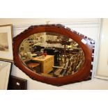 A mahogany framed bevelled edge wall mirror