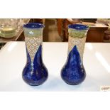 A pair of Doulton pottery vases, floral decoration