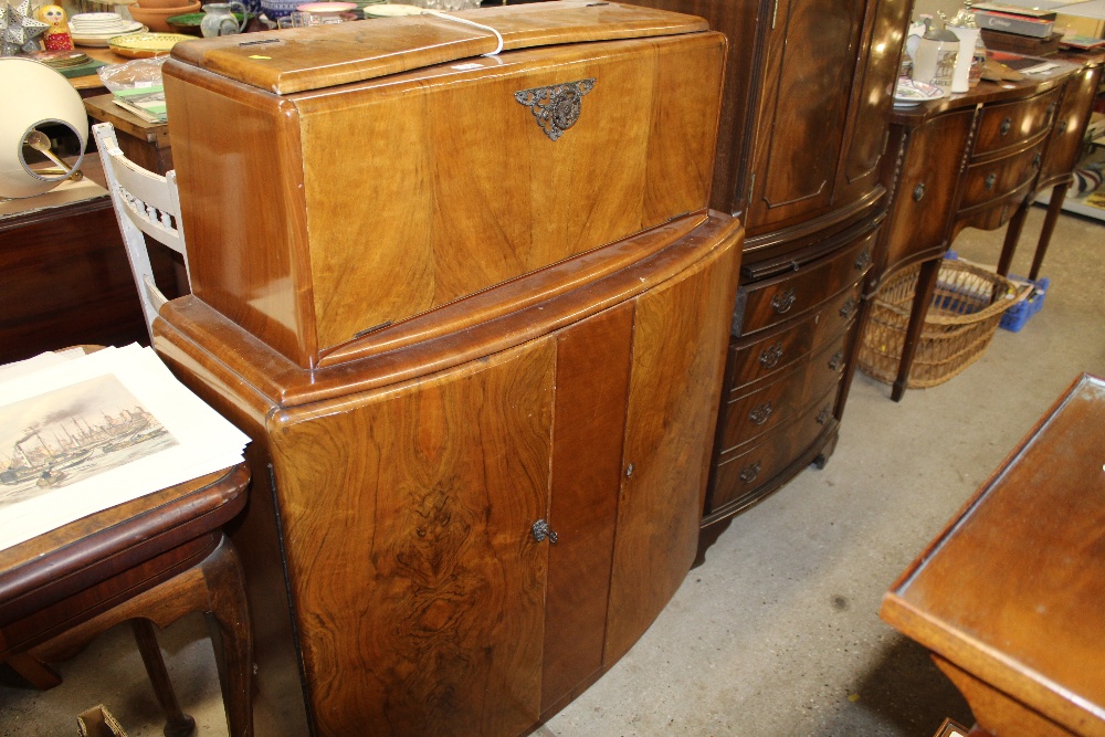 An Art Deco design walnut cocktail cabinet