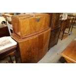 An Art Deco design walnut cocktail cabinet