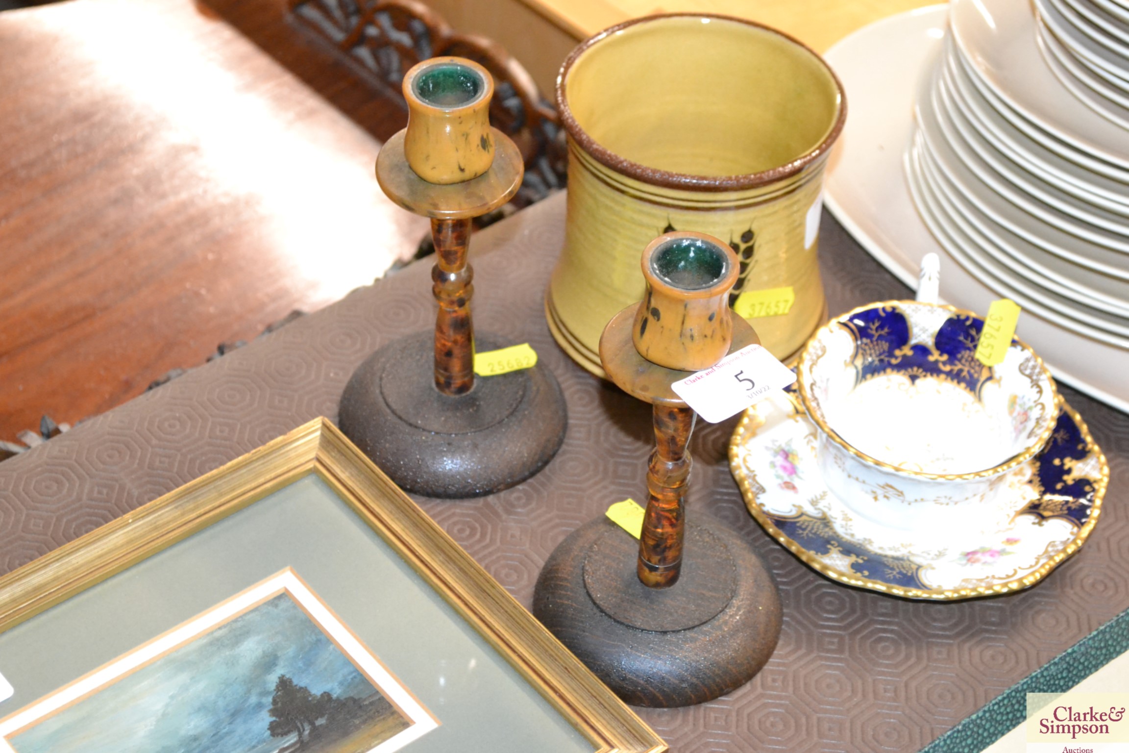 A pair of 1930's oak and Bakelite candlesticks