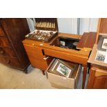 A teak cased pop up Singer sewing machine and acce