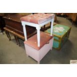 A pink upholstered button down dressing table stoo