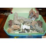 A tin and contents of various model cottages to in