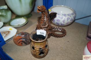 A prayer bowl together with a dragon ornament etc.