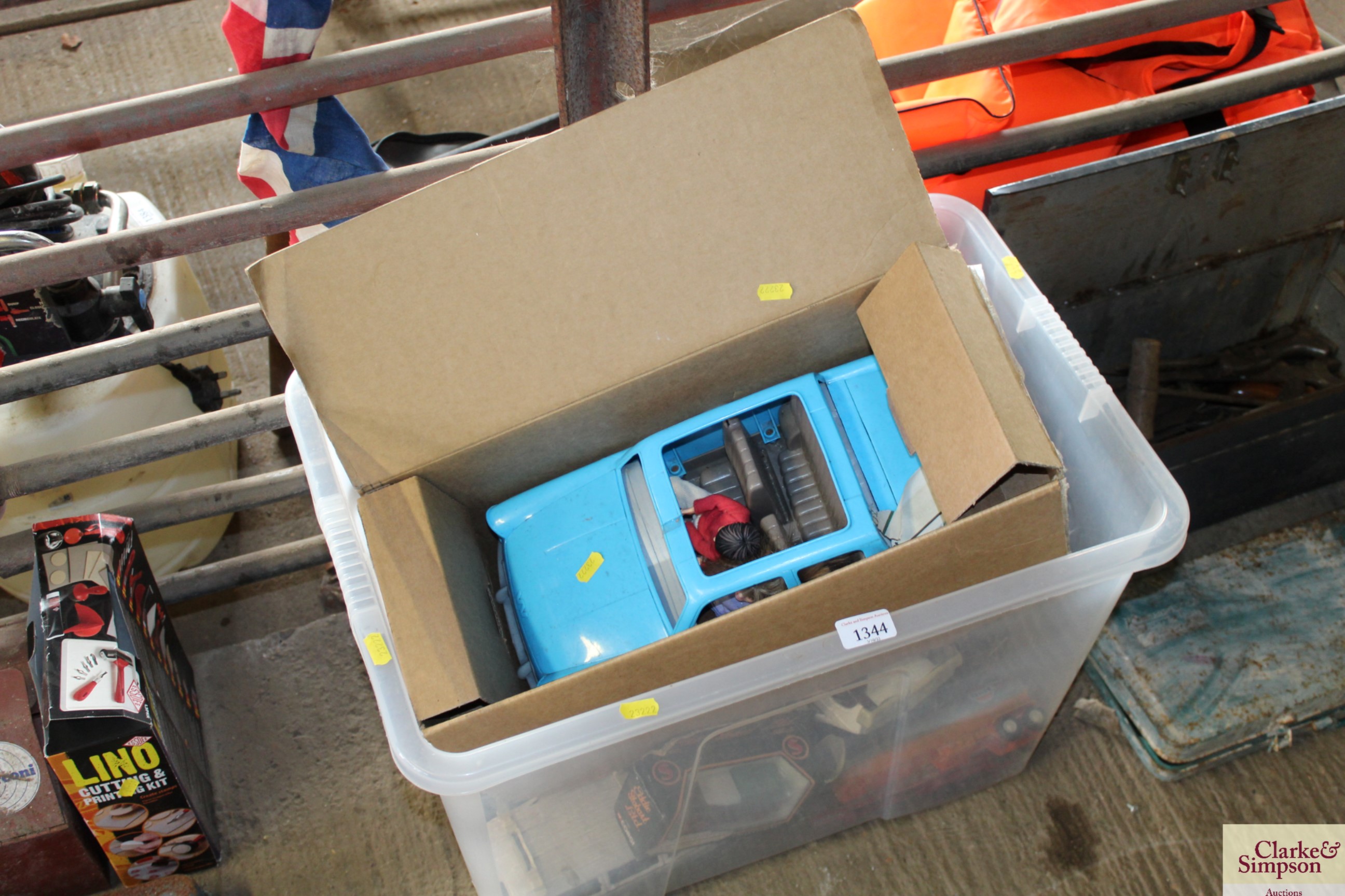 A box containing various toy cars etc.