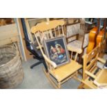 A beech spindle back rocking chair