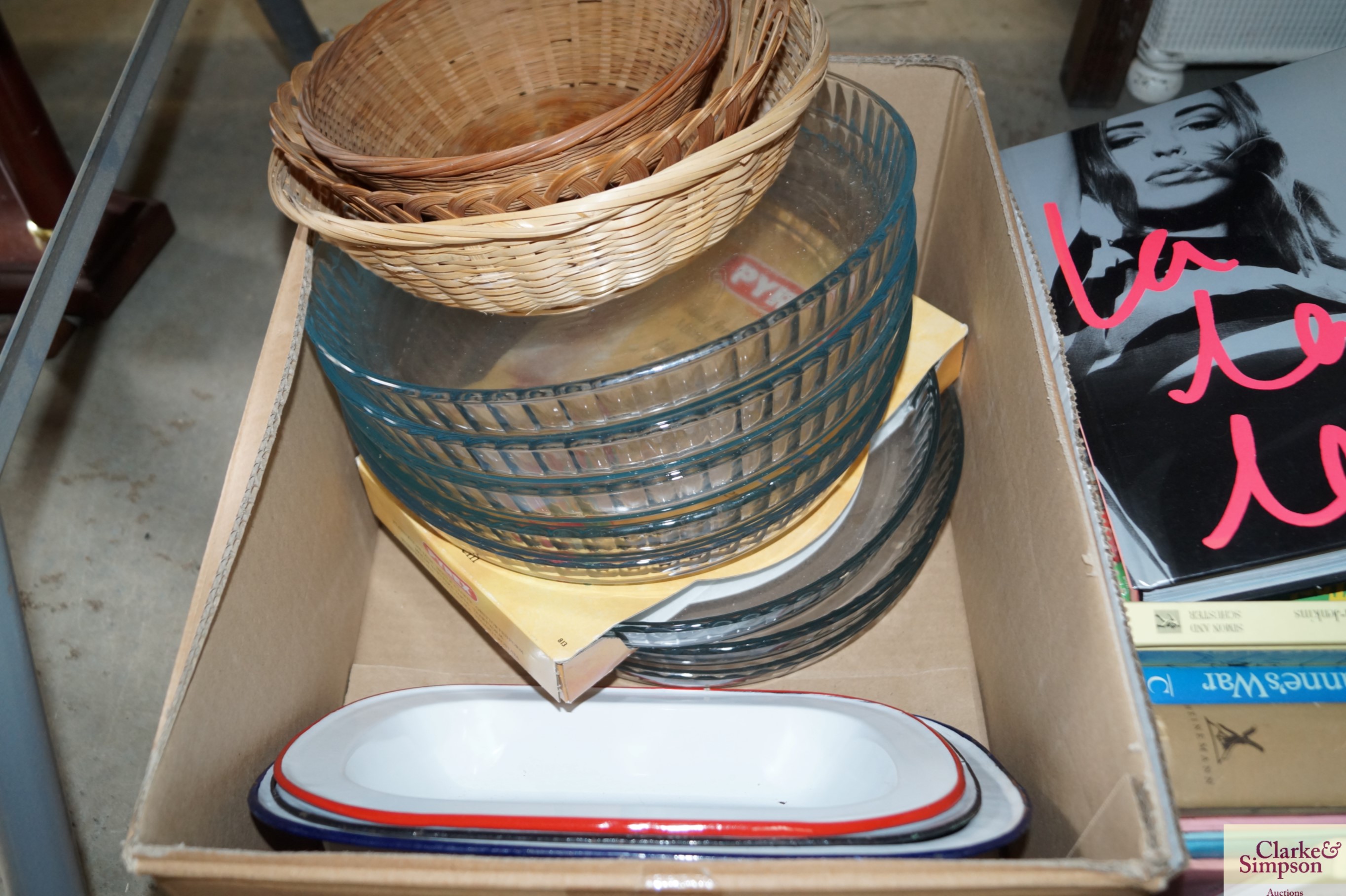 A box of glass dishes and enamel bowls