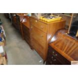 A teak chest fitted five long drawers