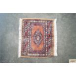 An approx. 1' x 1' Mori Jalder rug