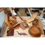 A quantity of carved wooden ornaments and bowls to