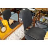 Two black upholstered swivel office chairs