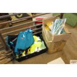 A box containing various hi viz jackets and a box