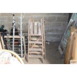 Two wooden step ladders