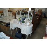 A French style kidney shaped dressing table with t