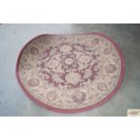 An approx. 3'11" x 3'11" floral pattern rug
