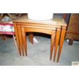 A teak nest of three occasional tables