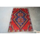 An approx.4'4" x 2'9" Baluchi rug