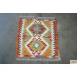 An approx. 1'6" x 1'5" Chobi Kelim rug