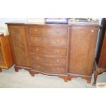 A reproduction break front sideboard, fitted five