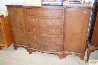 A reproduction break front sideboard, fitted five