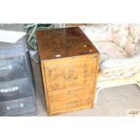 A wooden two drawer filing cabinet