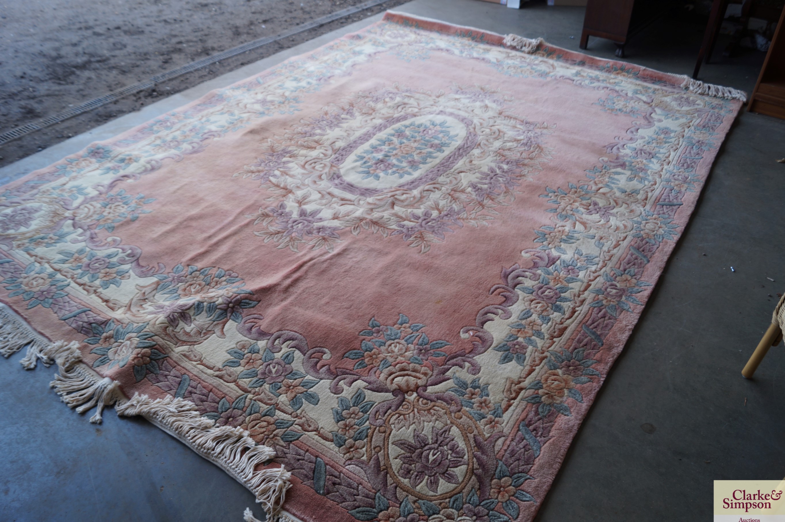 An approx. 12' x 8'6" Chinese wool rug