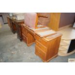 A dressing table with triptych mirror and stool