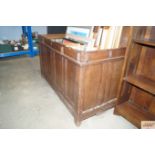 An antique oak panelled coffer