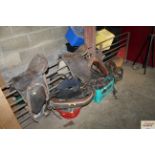 Two horse saddles and two boxes containing various