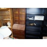 An oak bureau bookcase with leaded glazed doors